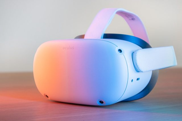 Apple's visionOS operating system may reshape competitive and product ecosystems Apple Vision Pro headset displayed on a stage with visionOS interface showing spatial computing apps and icons.