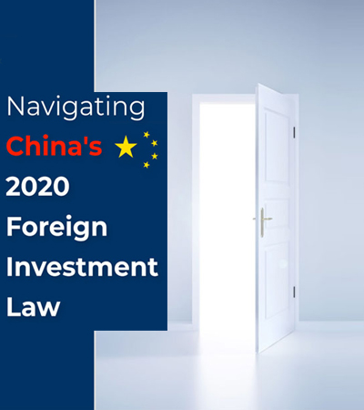 China Foreign Investment Law 2020 Chinese officials at a podium announcing the Foreign Investment Law with a banner reading 'Open for Business' in the background.