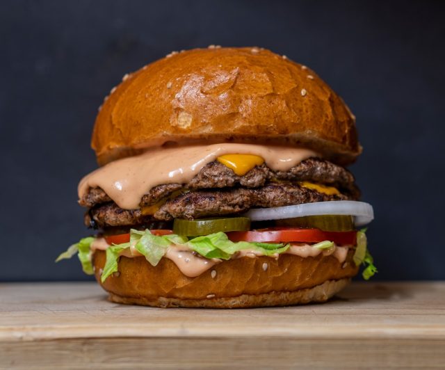 McDonald's E. coli outbreak linked to Quarter Pounder onions kills 1, sickens 104 A McDonald's Quarter Pounder burger on a counter, with slivered onions visible, representing the contaminated menu item in the E. coli outbreak.