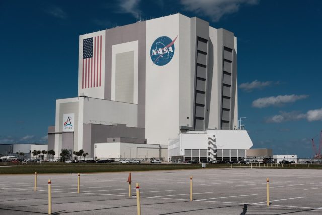 NASA's Decades of Unexplained Sky Observations Enter Public Records NASA control room monitors display satellite imagery and data feeds as analysts review unidentified aerial phenomena reports.