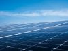 Talatan Solar Park Hits 21 GW, Powers Millions Vast array of solar panels stretching across the Tibetan Plateau under clear blue skies near Longyangxia Dam.