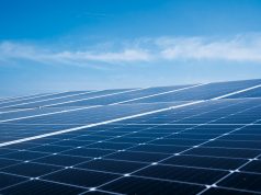 Talatan Solar Park Hits 21 GW, Powers Millions Vast array of solar panels stretching across the Tibetan Plateau under clear blue skies near Longyangxia Dam.