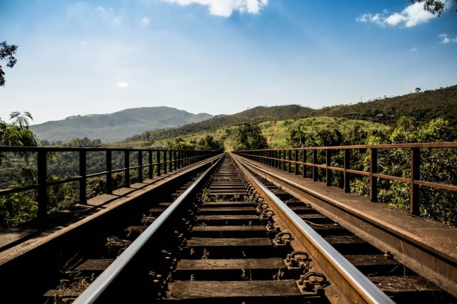 Bohumín Grapples with Rail Tragedy's Long-Term Impact on Town Identity A damaged train at a level crossing in Bohumín, with emergency responders and debris scattered near the tracks.