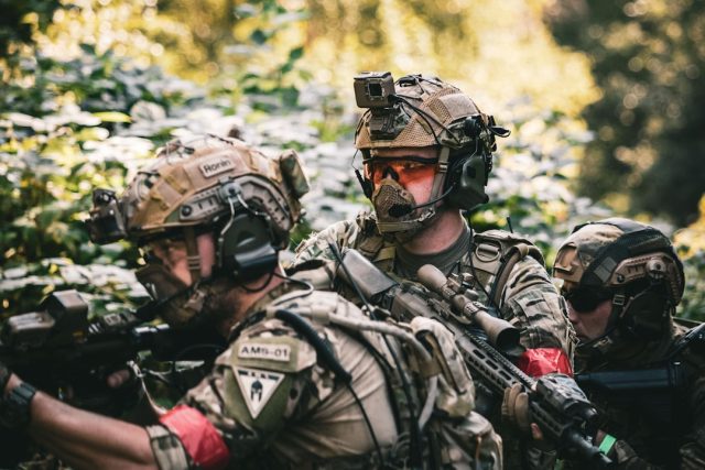 Drone Strike Analysis Reveals Shift in Regional Shadow War Tactics Smoke rises from a northern Israeli site after a drone strike, with military personnel assessing the damage amid tense skies.