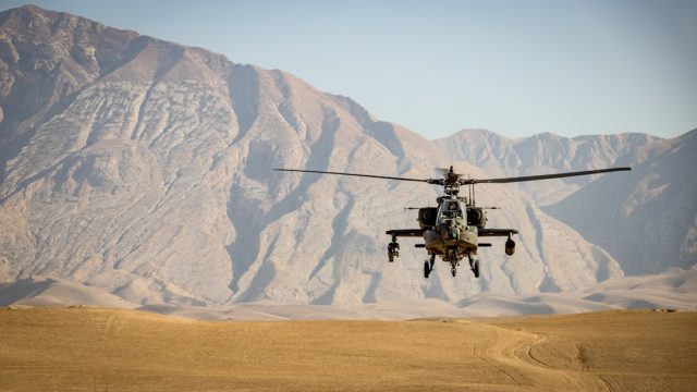 Houston Helicopter Crash into Radio Tower Kills Four, Raising Safety Questions A helicopter approaches a radio tower in a dense urban skyline, illustrating the risks of low-altitude flight.