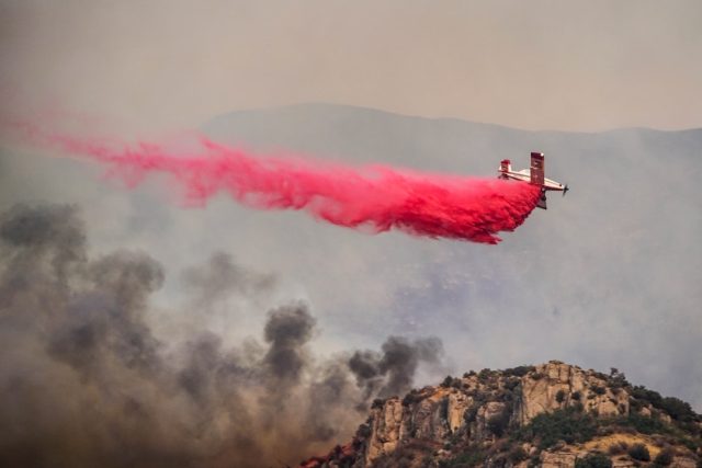 Pacific Palisades, Hollywood, Altadena Fires Kill 5, Destroy 1,000 Structures Flames consume hillside homes in Pacific Palisades as orange smoke billows over gridlocked evacuation traffic under fierce Santa Ana winds