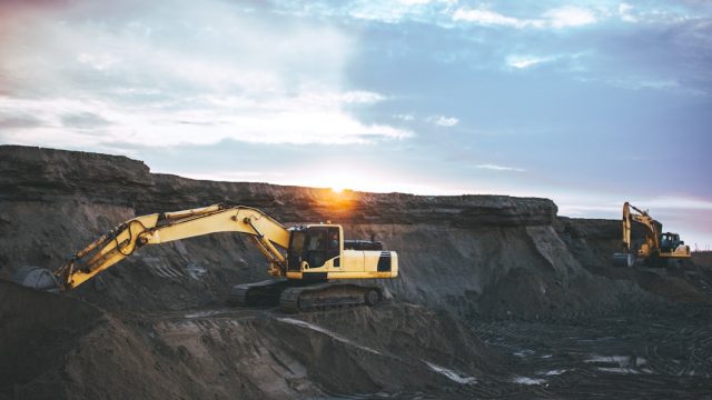 Tanzanian Hard-Rock Gold Mine Accident Kills Six from Mwakitolyo Village Rescuers gather near a collapsed hard-rock gold mine entrance in Tanzania, with villagers watching in distress.
