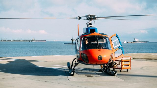 Helicopter Crash Near Kedarnath Temple Kills Seven, Including Infant Rescue workers search through forest debris near a crashed Bell 407 helicopter in Uttarakhand.