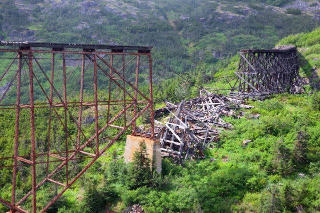 Gujarat Bridge Collapse Raises Questions About India's Infrastructure Safety Rescue workers search through debris of the collapsed Gambhira Bridge in Gujarat as vehicles and pedestrians fell into the water below.