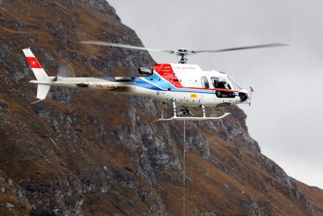 Helicopter Crash in Bajaur District Kills Five During Flood Relief Mission A Mil Mi-17 helicopter carrying aid flies over flooded terrain in Khyber Pakhtunkhwa province near the Afghan border.