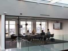 BBC Cuts 2,000 Jobs as Frozen License Fee Bites Empty BBC newsroom desks lit by overhead lights after 2,000 job cuts announcement