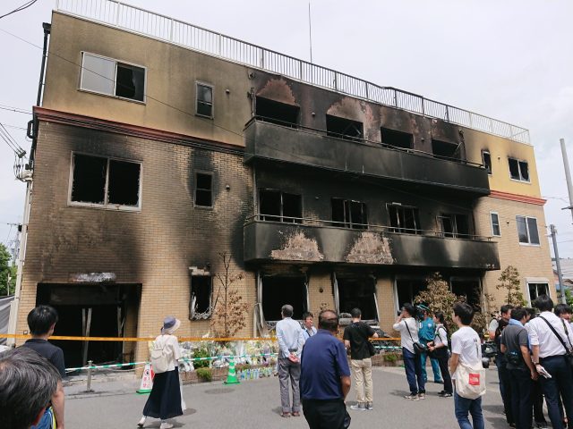Portugal Arrests Twelve Suspects in Connection with Deadly Wildfires Charred pine forest and smoke rise behind Portuguese police tape near a village in Viseu district.