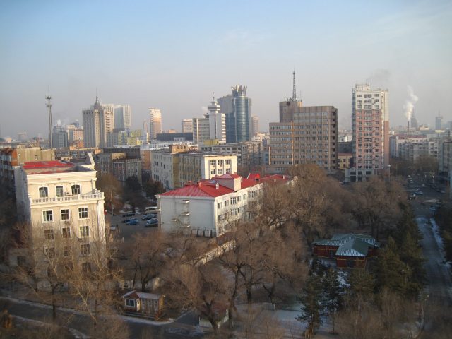Roof Collapse at Chinese School Kills Eleven, Injures Three People Rescuers search through debris after a school roof collapse in Qiqihar, China, with emergency vehicles nearby.