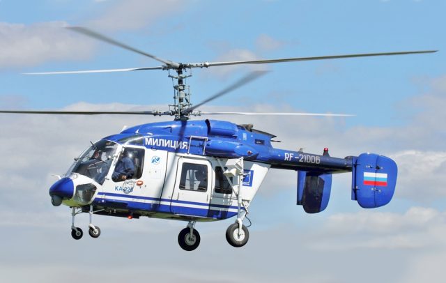 Helicopter Crash in Dagestan, Russia Leaves Five Dead, Two Injured Smouldering Ka-226 helicopter wreckage lies on a Dagestan hillside as rescuers secure the crash site.