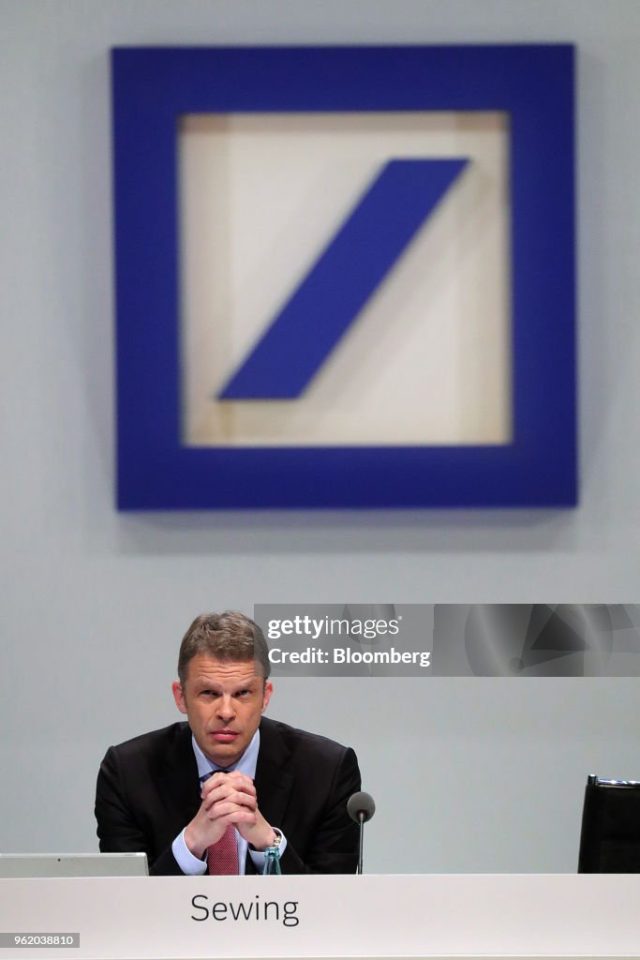 Deutsche Bank Christian Sewing Announcement Deutsche Bank CEO Christian Sewing speaking at a press conference announcing the bank's strategic shift toward corporate banking.