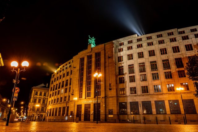 Halkbank's 90-Year History Collides with Present Challenges for Turkish Finance Halkbank building exterior in Ankara, Turkey, with Turkish flag flying overhead, symbolizing the bank's government ownership.