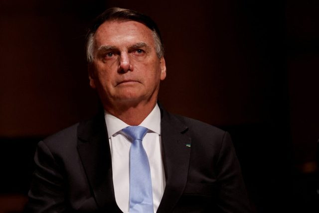 Jair Bolsonaro Brazil President 2024 Jair Bolsonaro speaking at a political event in Brazil, gesturing with his hands.