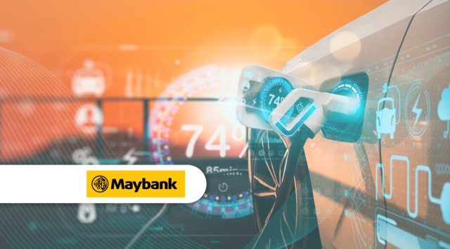 Maybank Ev Financing Kuala Lumpur Maybank EV charging station at Dataran Maybank with a plugged-in electric car under the Kuala Lumpur skyline.
