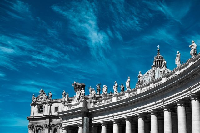 Theology, Not Pastoral Work, Defined Joseph Ratzinger's Rise in Church Joseph Ratzinger, Pope Benedict XVI, in white papal robes, seated at a desk with books, representing his theological focus.