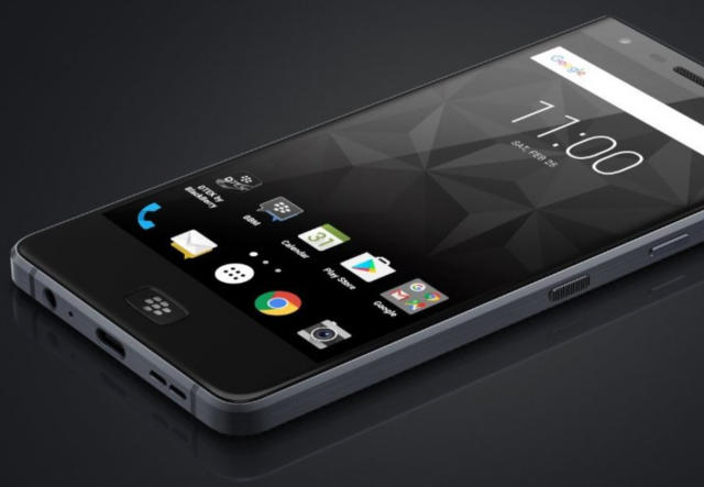Tcl Blackberry Phone Final Model TCL and BlackBerry logos on a smartphone display at a technology trade show