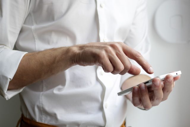 Google Play Approval Undermines Truth Social's Free Speech Vow Truth Social app icon on a smartphone screen with Google Play Store approval badge visible