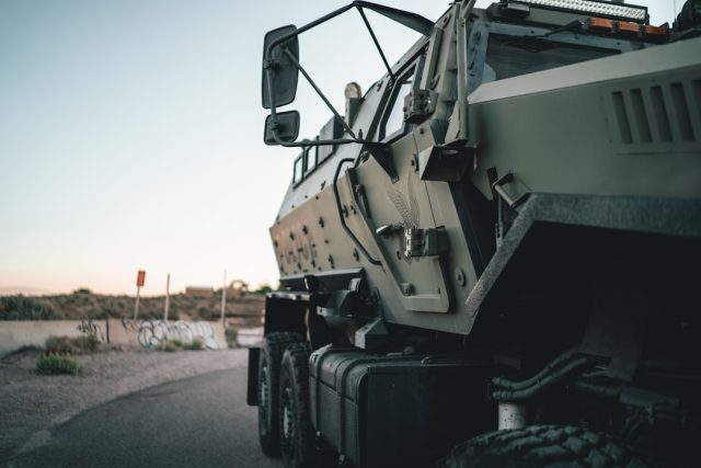 US commits $3.75B in new Ukraine aid, largest single package since invasion A line of Bradley armored vehicles and Humvees being loaded for transport to Ukraine at a US military base.
