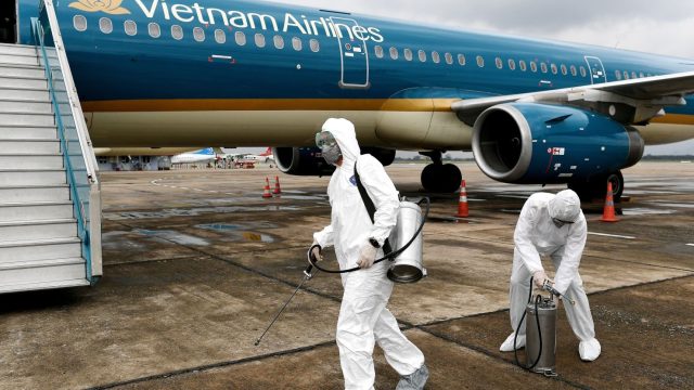 Vietnam Airlines Grounded Planes Coronavirus A Vietnam Airlines passenger jet parked on a tarmac with empty airport terminals in the background during the coronavirus outbreak.