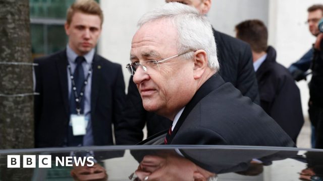 Volkswagen Dieselgate Settlement Talks 2020 Lawyers shake hands across a conference table as VW and consumer group begin dieselgate settlement negotiations.