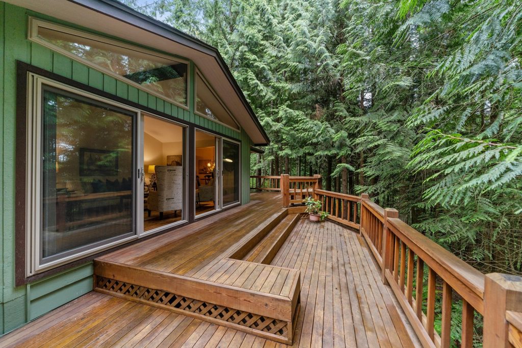 Woman Builds Rustic Deck From Pallets